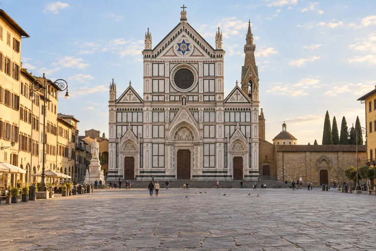 Illustration of the marble facade of Santa Croce facing its broad piazza.